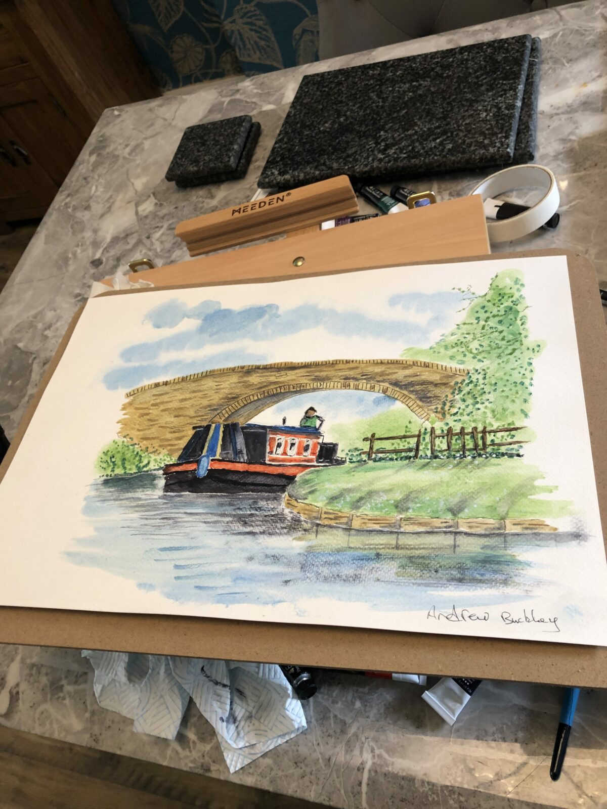 Canal boat and stone bridge