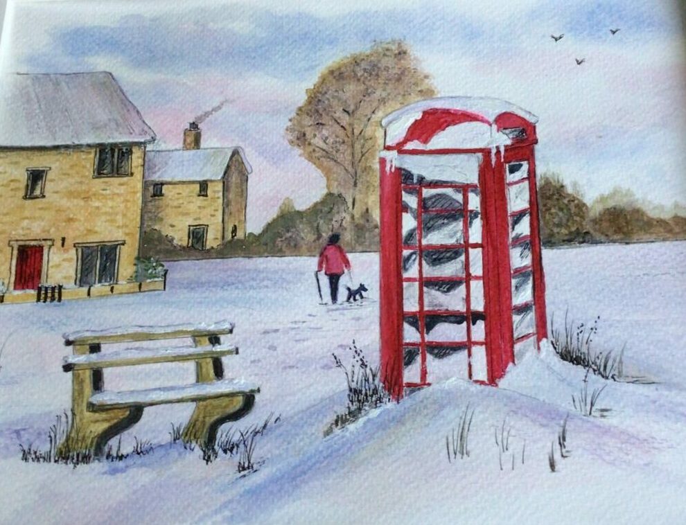 red phone box in snow