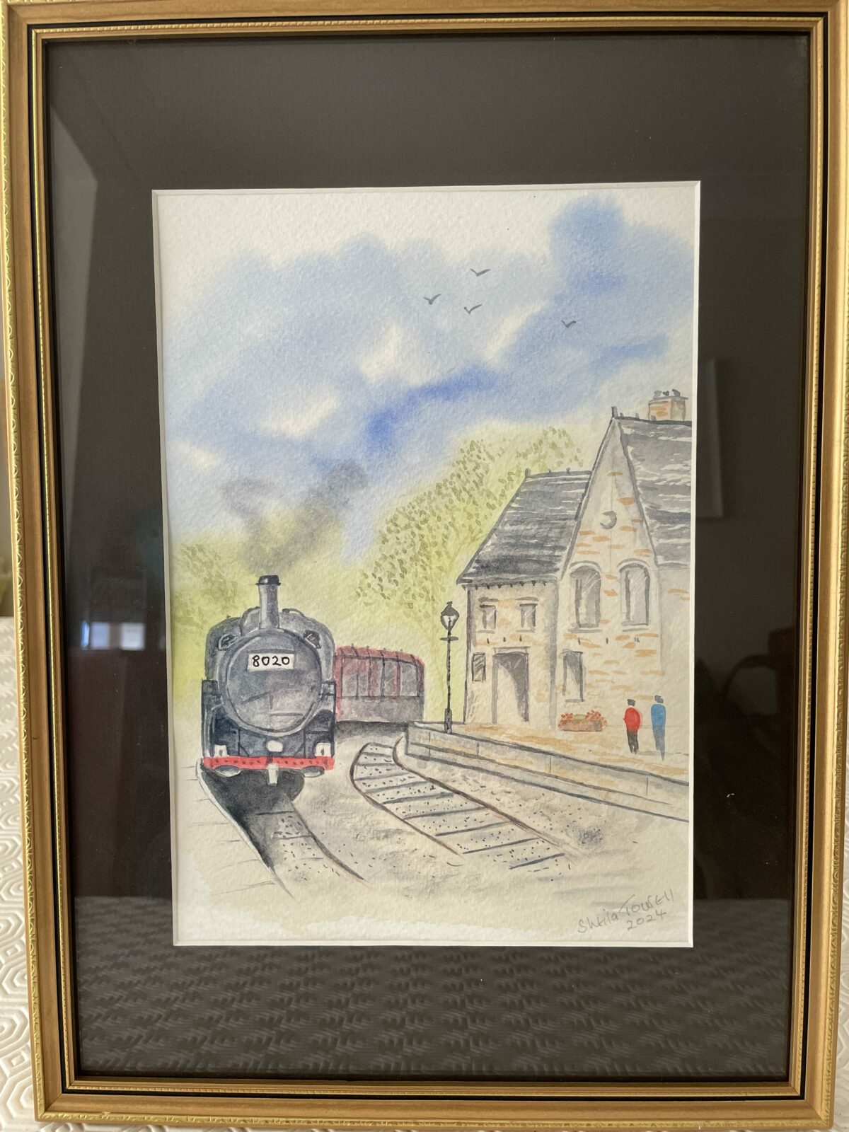 Old Victorian Railway Station with steam train